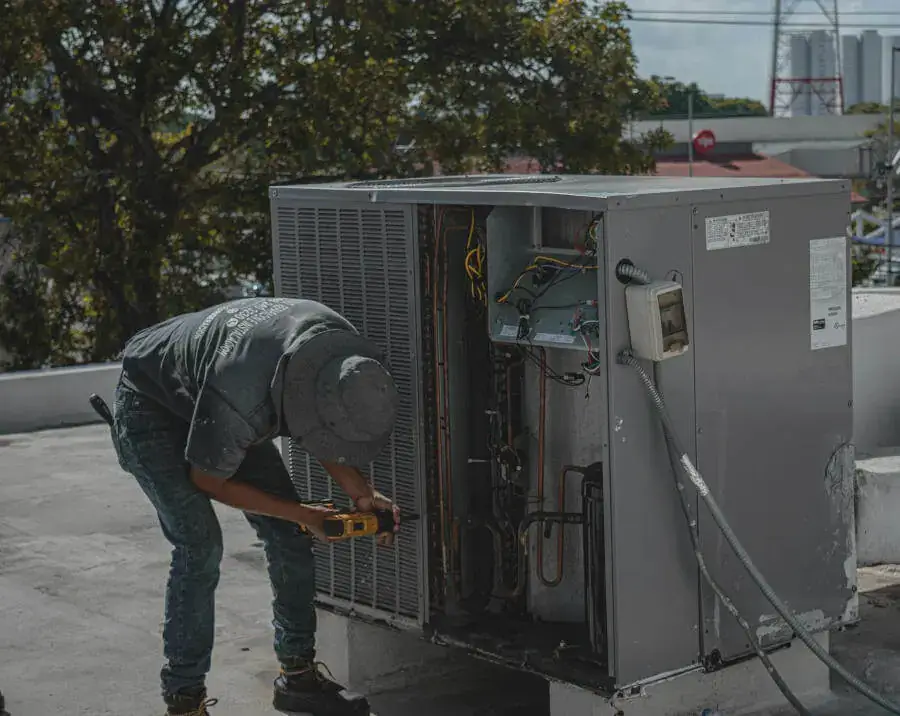 HVAC Technician Performing Maintenance